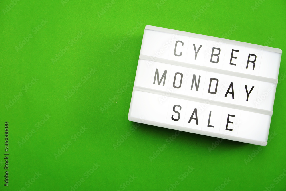 Wall mural cyber monday sale flat lay top view on green background