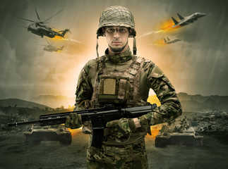 Armed soldier with sniper in the middle of a war
