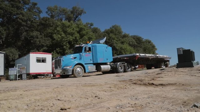 Peterbilt oversize heavy duty truck backing up on construction site.