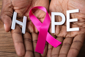 Man Holding Ribbon With Hope Text