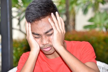 Stressful Asian Teen Boy