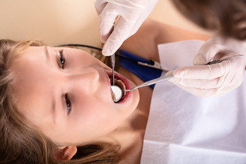 Patient Being Checked By Dentist