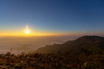 Sun rise at Phu Chi Duen is a mountain area and national forest park in Thailand. It is located at the northeastern end of the Phi Pan Nam Range, southwest of Doi Pha Tang. Chiang Rai