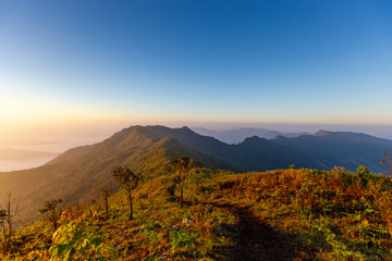 Sun rise at Phu Chi Duen is a mountain area and national forest park in Thailand. It is located at the northeastern end of the Phi Pan Nam Range, southwest of Doi Pha Tang. Chiang Rai