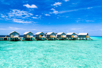 Beautiful tropical Maldives resort hotel and island with beach and sea on sky for holiday vacation background concept