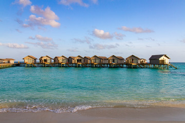 Beautiful tropical Maldives resort hotel and island with beach and sea on sky for holiday vacation background concept