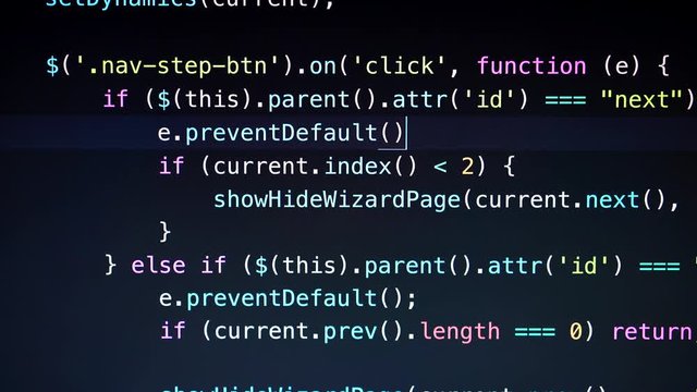 Javascript coding in dark. Captured from a straight POV angle.