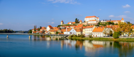 Fototapeta na wymiar Scenic panoramic view of river Drava and castle on hill in old historic touristic town Ptuj in Slovenia