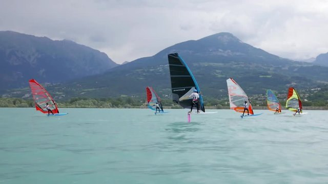high speed chase shot of foilwindsurferq during a race in France