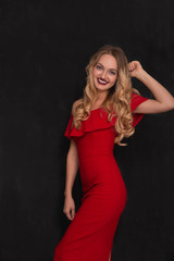 Beautiful woman wearing red dress and looks so happy. Christmas.