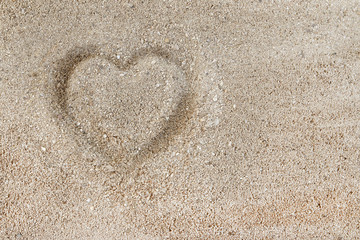 Heart drawn symbol in the sand.