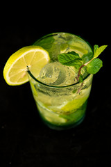 Mojito Cocktail with rum, brown sugar, lemon juice, mint and soda water
