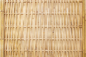 old grungy thai handcraft of bamboo weave pattern fence.