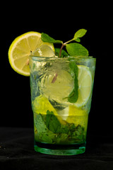 Mojito Cocktail with rum, brown sugar, lemon juice, mint and soda water