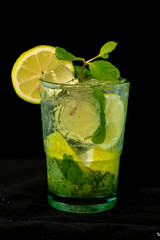 Mojito Cocktail with rum, brown sugar, lemon juice, mint and soda water