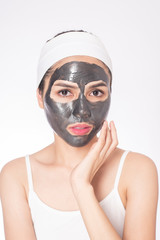 beautiful woman masking her face on white background