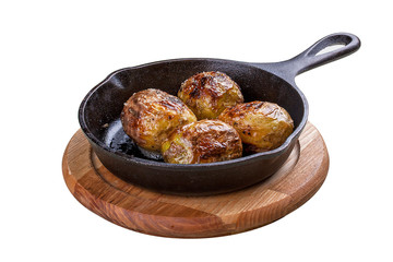 Baked whole potatoes in the pan. On a white background.