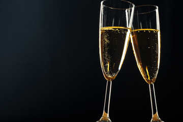 Champagne glasses for festive occasion against a dark background