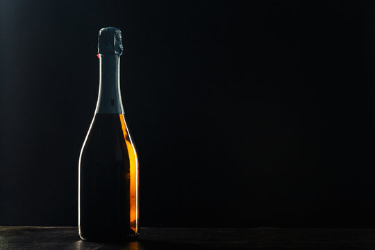 Bottle Of Champagne On Black Background.