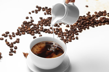 Coffee bean small cup full of coffee bean isolated on white