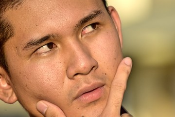 Obraz premium Thoughtful Handsome Filipino Person