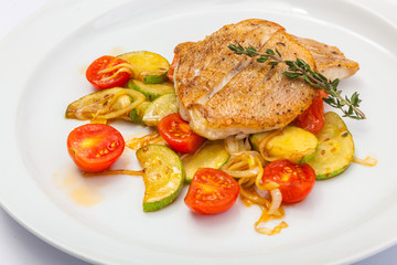 Fried fish on vegetables