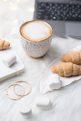 Lady bloggers white work place with business details, laptop, co
