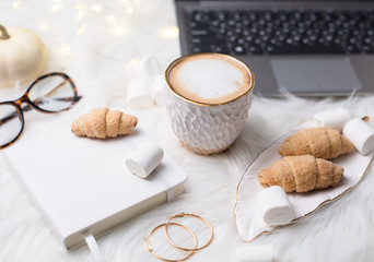 Lady bloggers white work place with business details, laptop, co