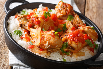 Haitian stewed Chicken (poulet creole) with rice closeup. horiontal