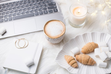 Lady bloggers white work place with business details, laptop, co