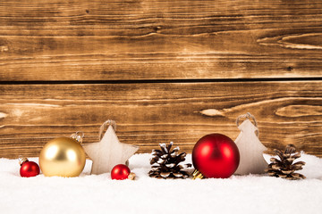 christmas decoration in snow wooden background