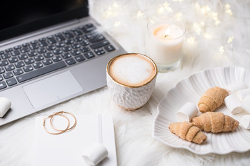 Lady bloggers white work place with business details, laptop, co
