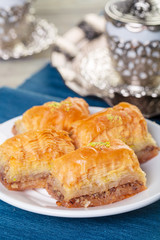 Oriental sweets, baklava, sherbet on a blue background