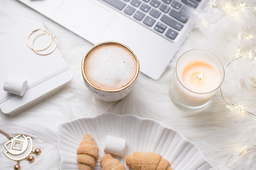 Lady bloggers white work place with business details, laptop, co