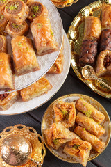 baklava with pistachio. turkish traditional delight on a dark wood background