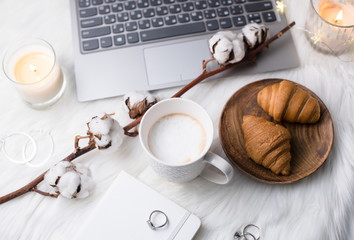 Lady bloggers white work place with business details, laptop, co