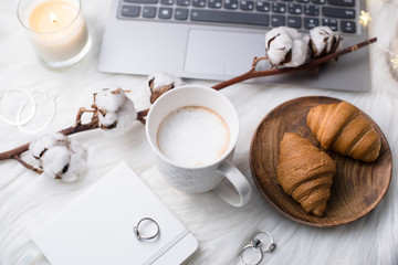 Lady bloggers white work place with business details, laptop, co