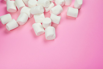 Marshmallows on pink background