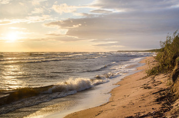 Stormy weather on the coast of Ladoga lake at sunset Karelia Russia