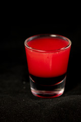 Red shot cocktail with jagermeister, cranberry juice and schnapps