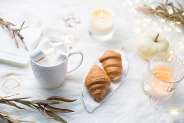 Cozy winter bloggers white work space with laptop, coffee with m