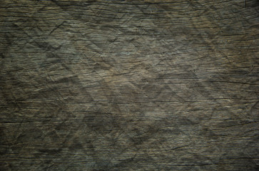 Background or Wallpaper and Detail of dark hardwood floors polished and crumpled like paper in shades of gray.