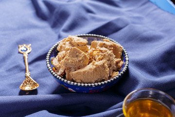 Tasty halva with tea on the table