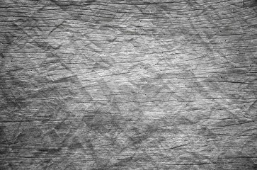 Background or Wallpaper and Detail of dark hardwood floors polished and crumpled like paper in shades of gray.