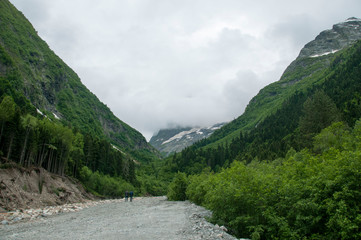 Fototapeta na wymiar Closeup view mountains and river scenes in national park Dombai, Caucasus, Russia, Europe.