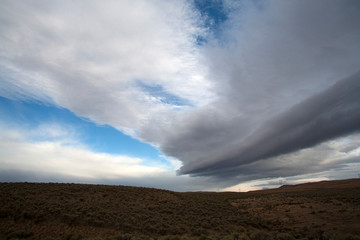 Fototapeta na wymiar clouds over field