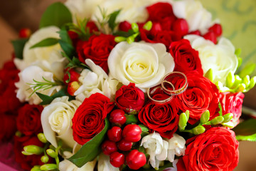 Gold rings on a wedding bouquet