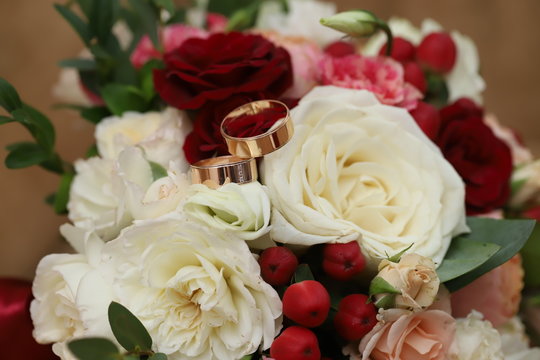 Gold rings on a wedding bouquet