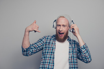 Photo of attractive handsome man stand isolated on light gray wa
