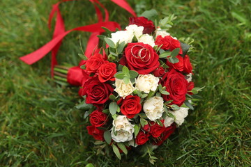 Gold rings on a wedding bouquet